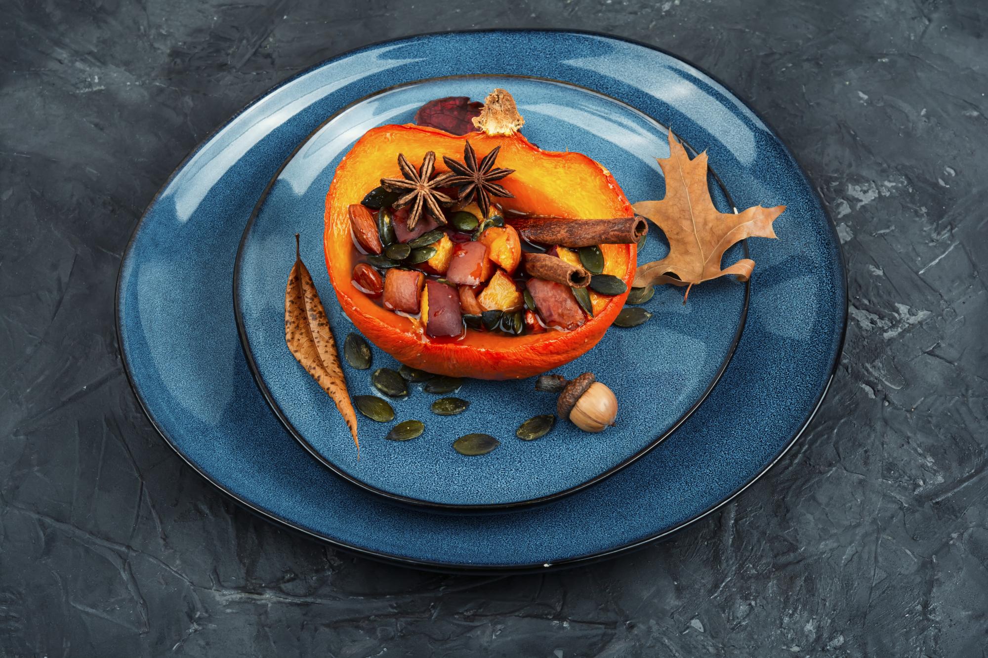 plated seasonal entrée on dark table